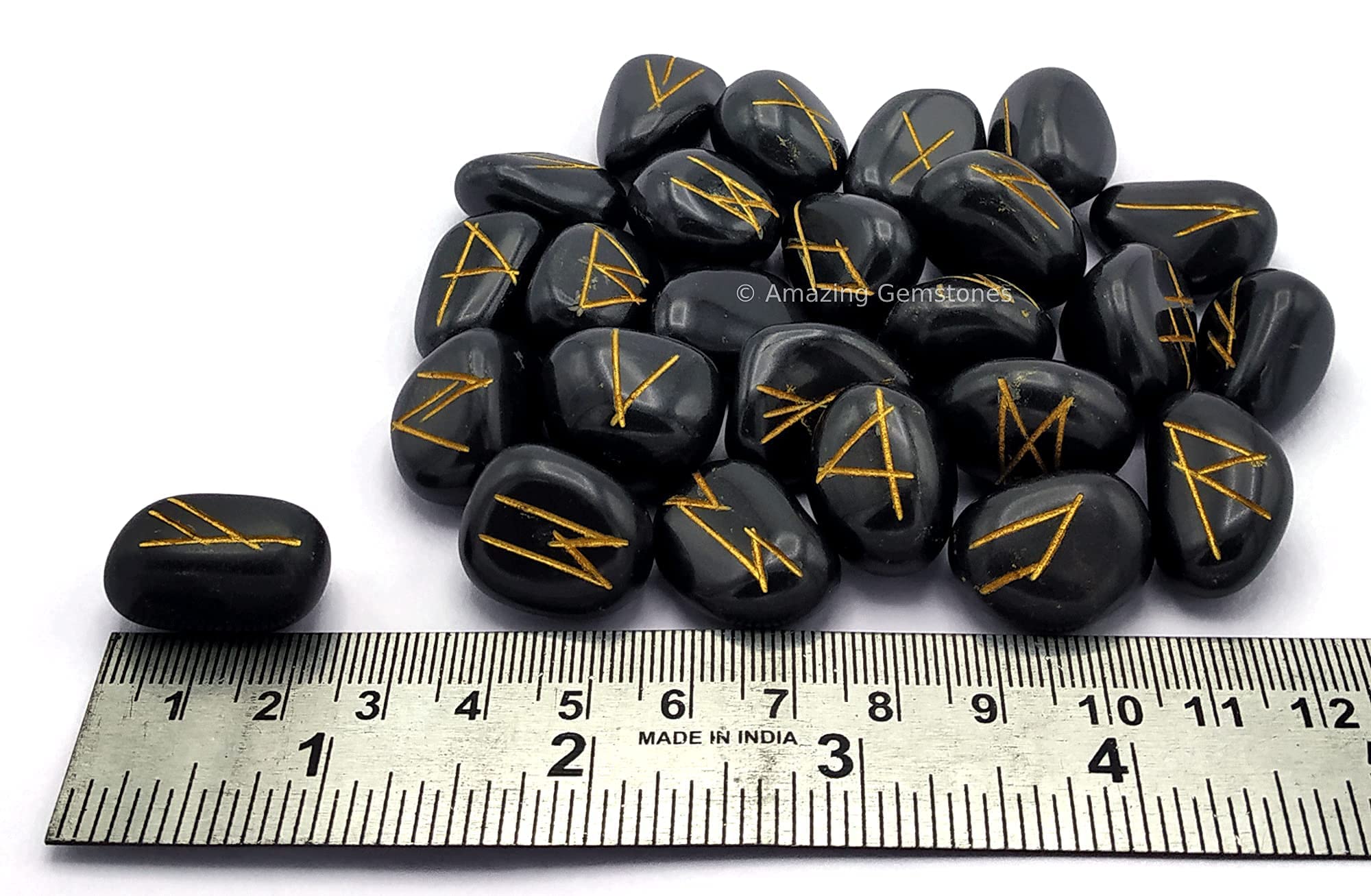 Amazing Gemstone close-up shows fine engraving on a black agate rune