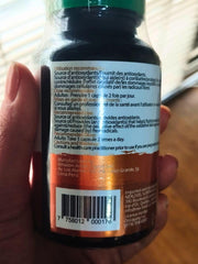 Amazon Andes Aguaje capsules label closeup, emphasizing non-GMO Peruvian origin.