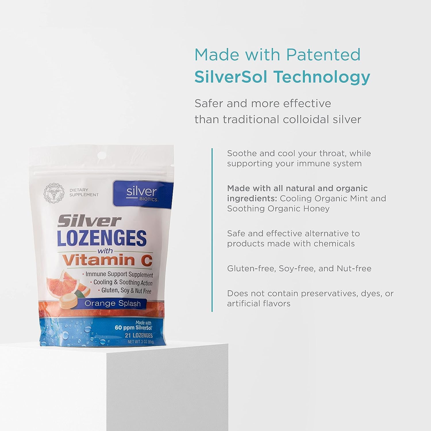 Orange flavor swirl around Silver Biotics lozenge.