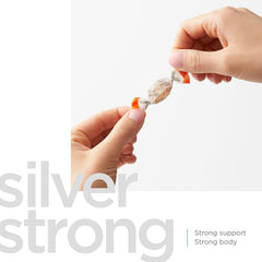 Silver Biotics lozenge texture close-up showing smooth surface.