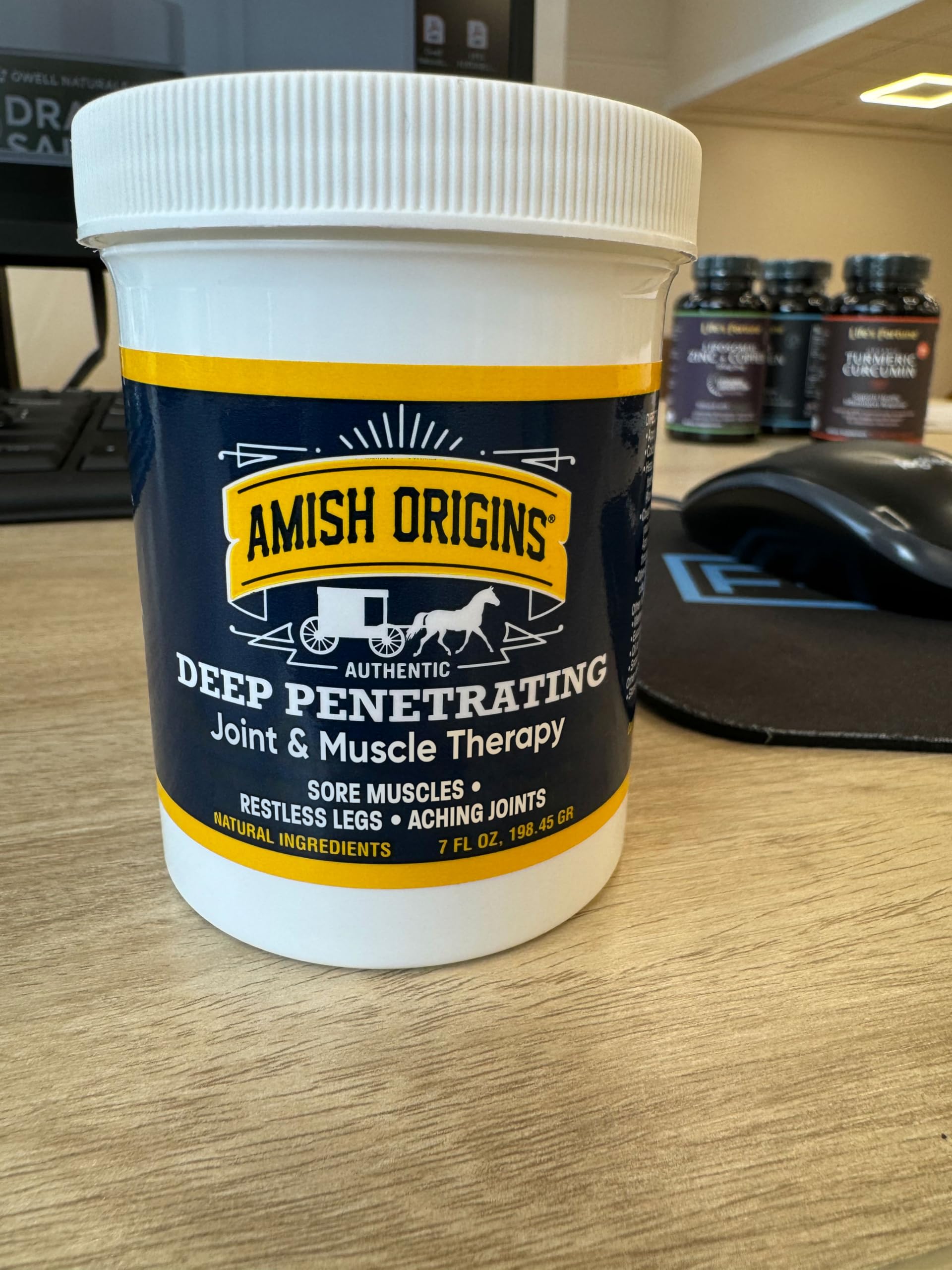 Cream texture close-up of Amish Origins ointment showing greaseless, smooth application.