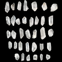 AMOYSTONE rough clear quartz pieces showcase natural variations ideal for display.