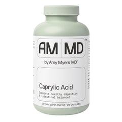 Amy Myers MD Caprylic Acid bottle on a kitchen counter supporting balanced digestion.