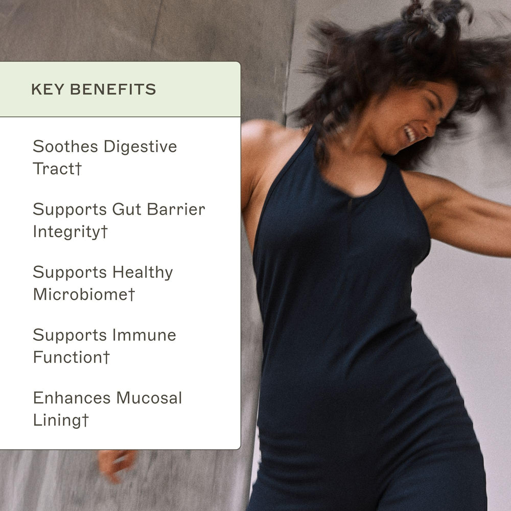 Pouring Leaky Gut Revive powder into a glass of water for easy use.