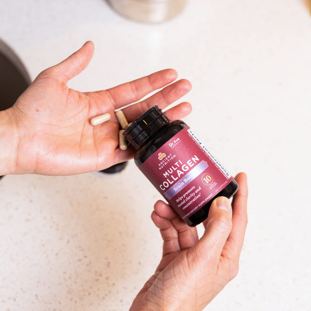 Ancient Nutrition Brain Boost capsules poured from bottle illustrate convenient daily joint and skin support