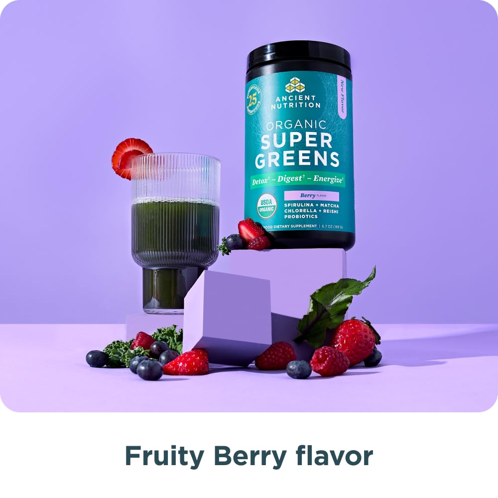 Ancient Nutrition SuperGreens berry-flavored powder in a glass highlighting natural color and taste.
