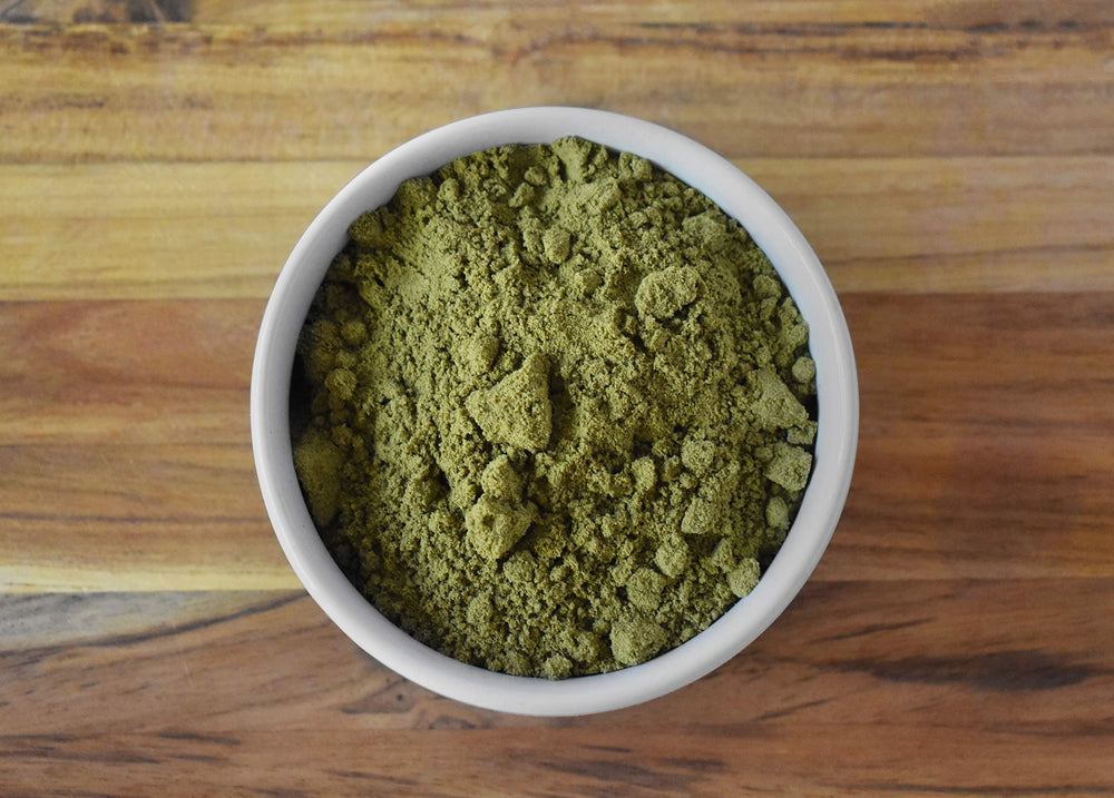Stirring Anthony's hemp protein powder into oats for breakfast.