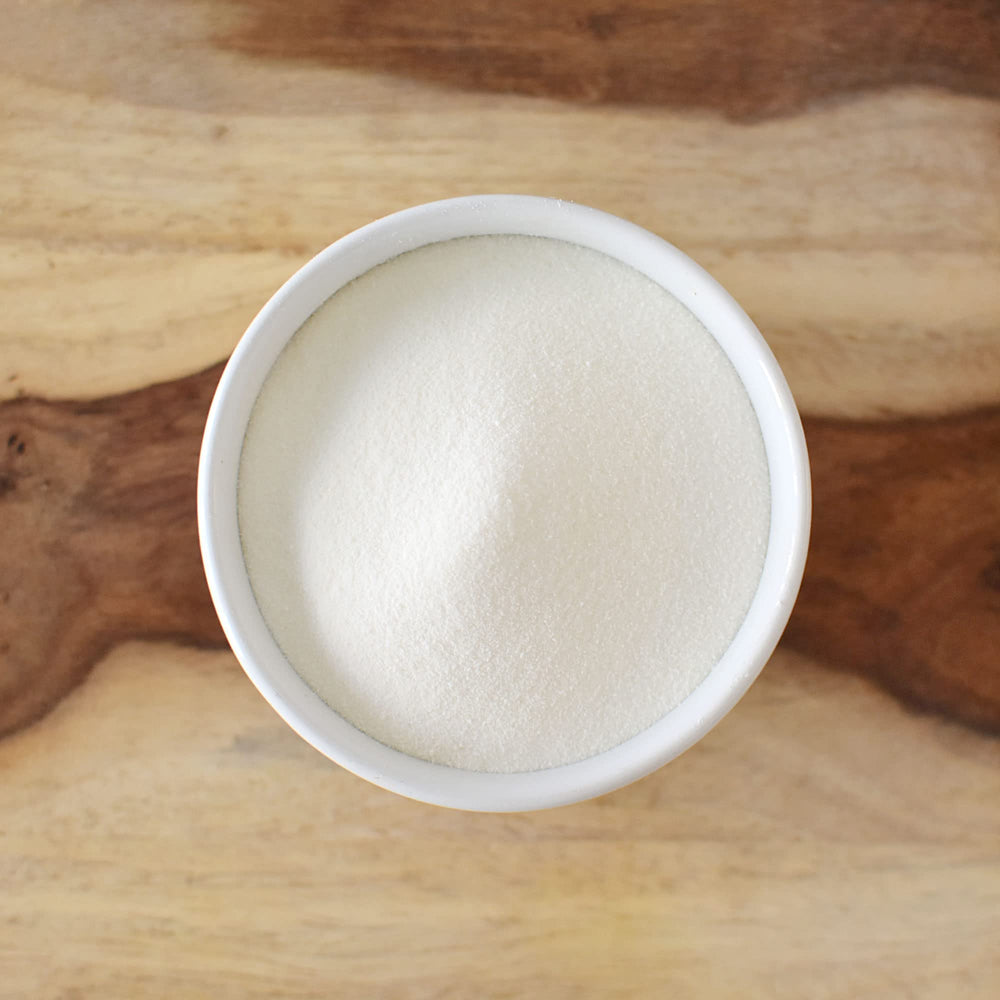 Anthony's Collagen Powder being poured into coffee for a protein-rich start.