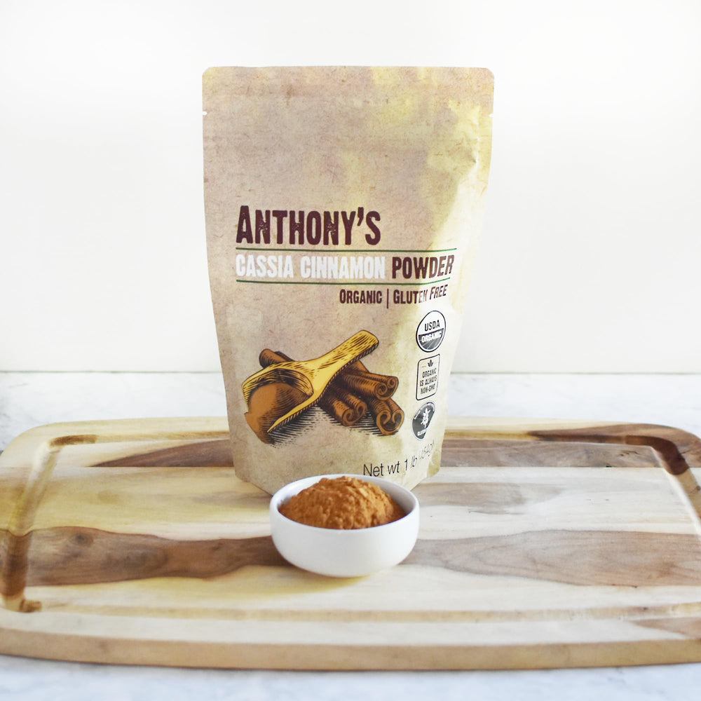 Baking scene with Anthony's cinnamon powder dusting a dish.