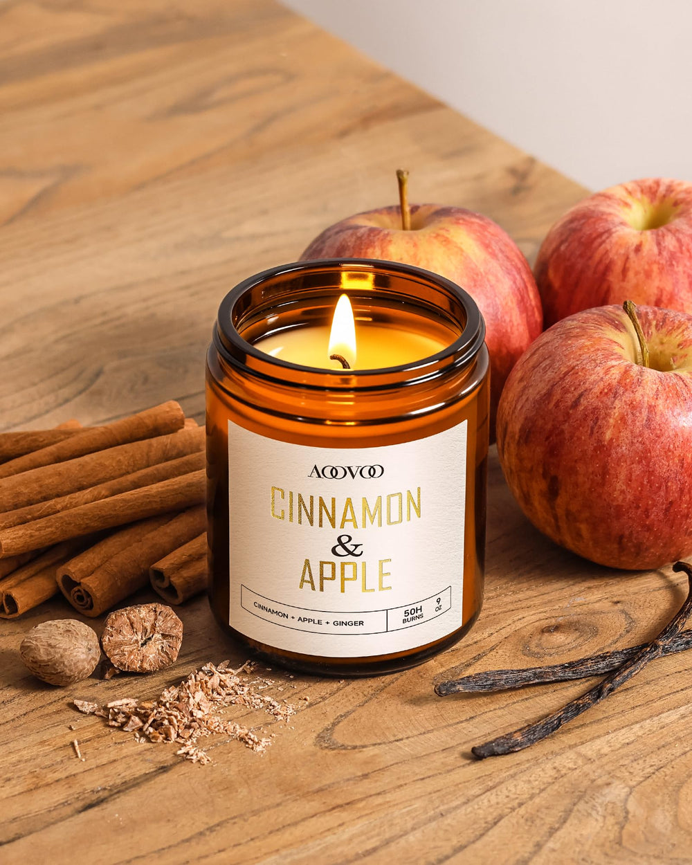 AOOVOO Apple Cinnamon Candle held in hands for intimate aromatherapy moments.