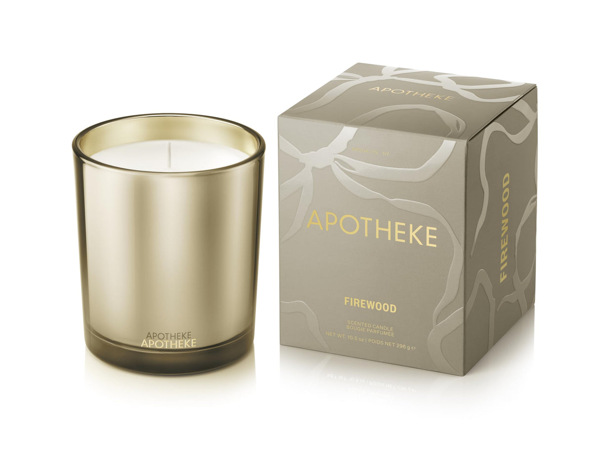 APOTHEKE Firewood candle in a brown jar for warm, lasting home fragrance.