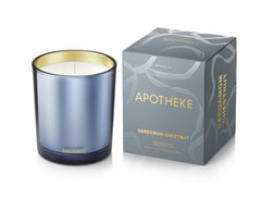 APOTHEKE signature candle in blue jar enhances ambiance with lasting fragrance.