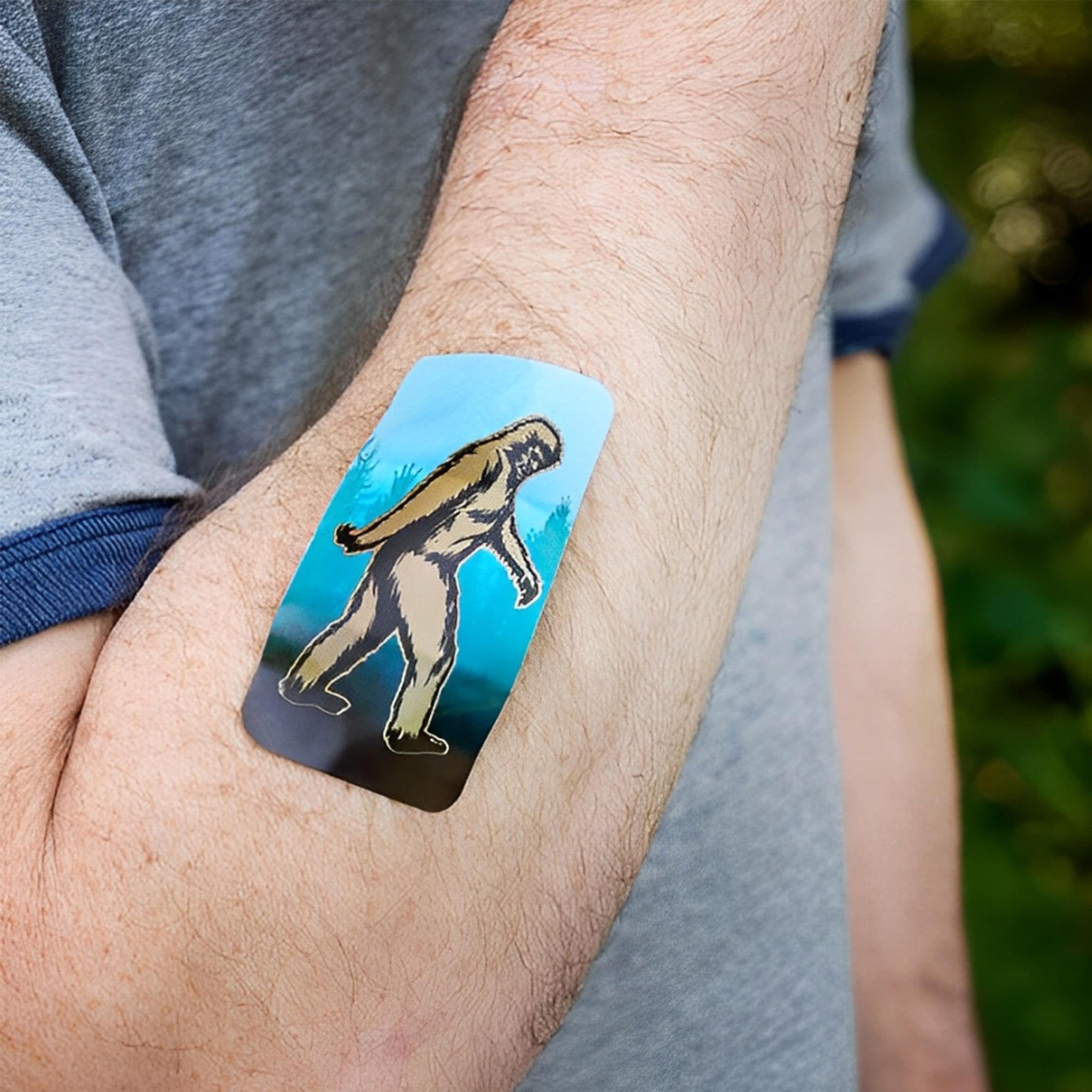 Archie McPhee Bigfoot Bandages tin includes a free surprise inside.