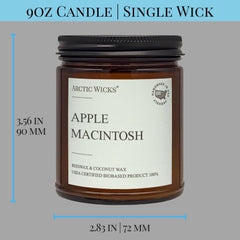 Arctic Wicks amber jar on wood surface creates warm home atmosphere.