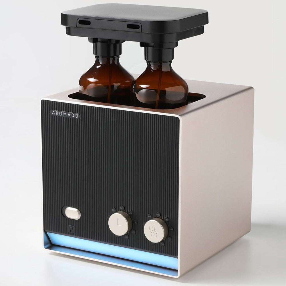 Aromadd dual-nozzle diffuser demonstrates two scent options for flexible ambiance.