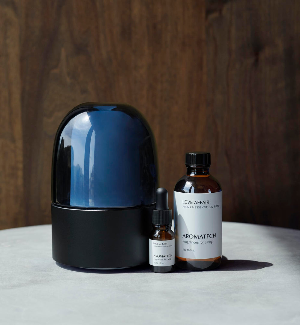 AromaTech Love Affair bottle pour demonstrates precise dosing for effortless diffusion.