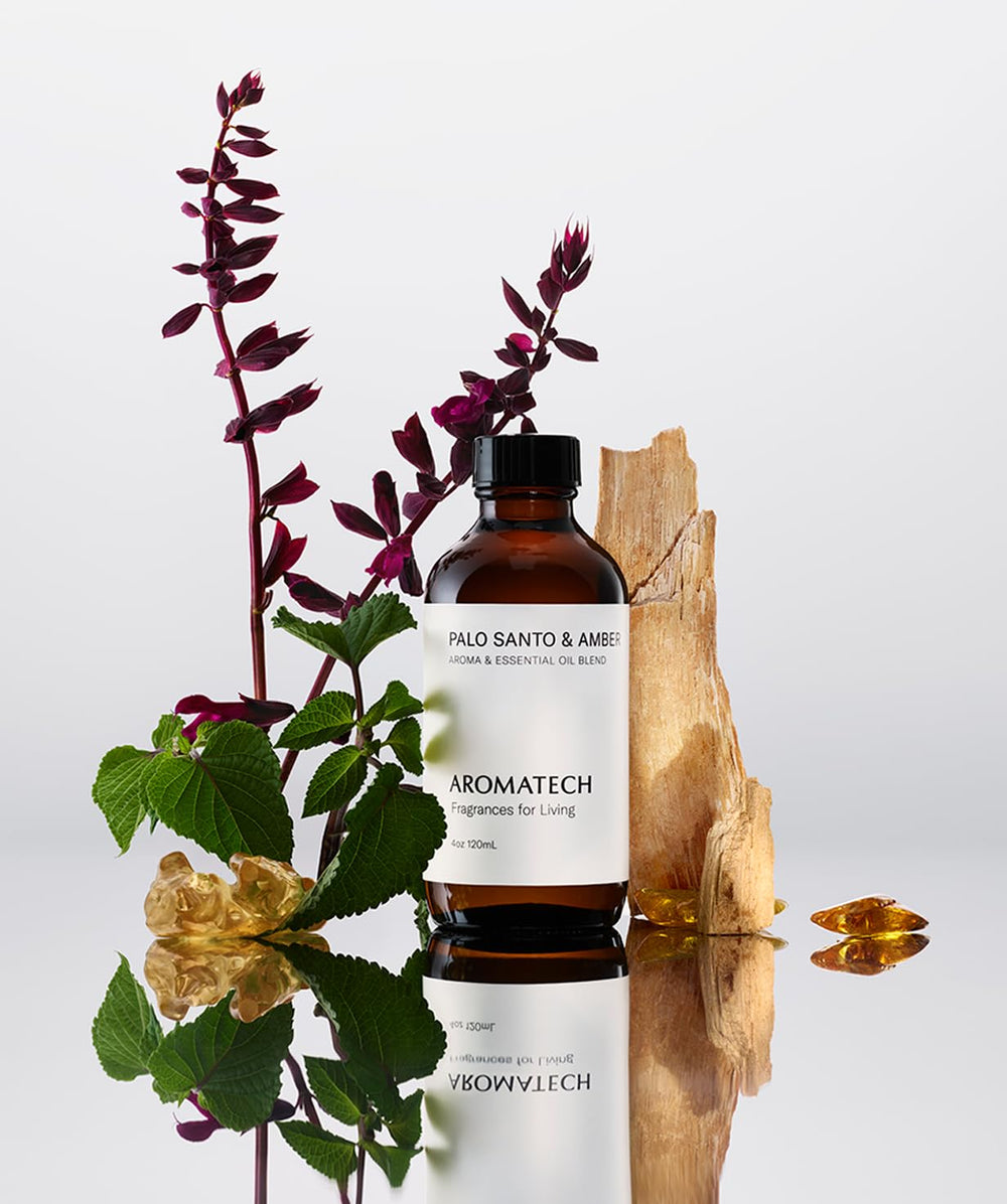 AromaTech Palo Santo & Amber 10 ml bottle beside a diffuser for versatile room use.