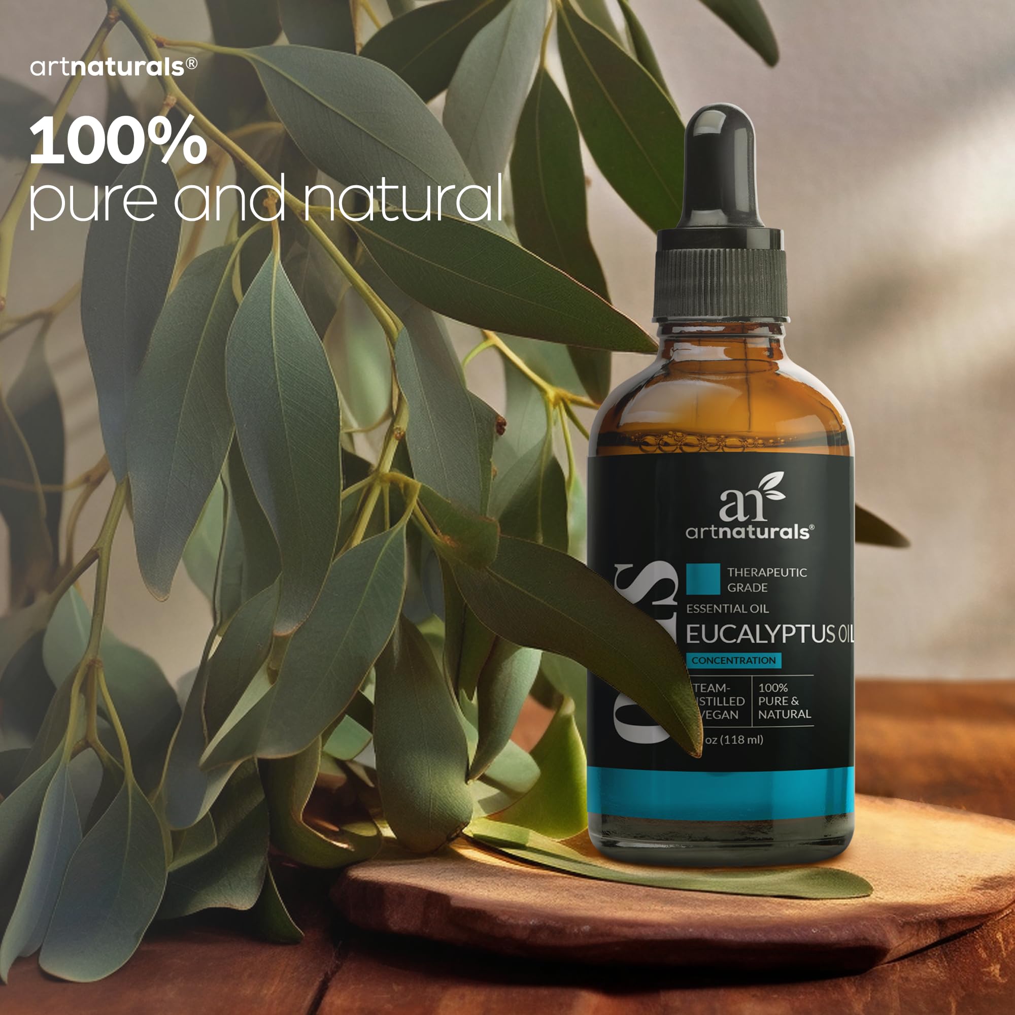 ArtNaturals eucalyptus oil bottle beside bath accessories for DIY bath blends