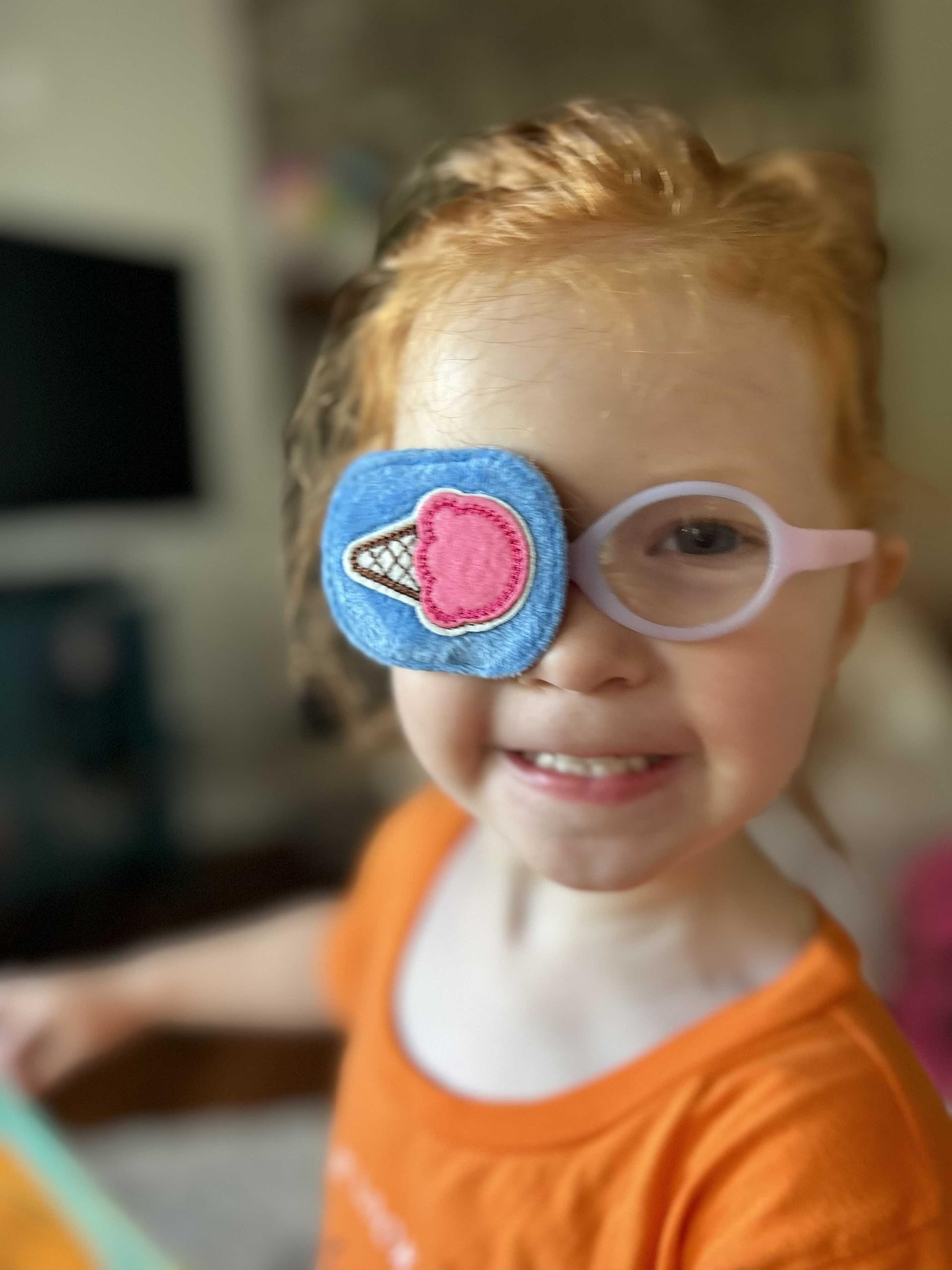 Astropic kid-wearing eye patch demonstrates over-glasses fit with comfortable, non-irritating use.