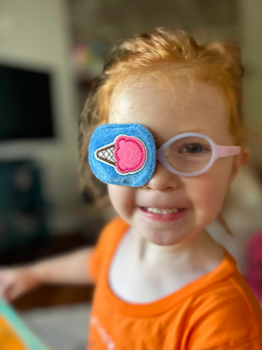 Astropic kid-wearing eye patch demonstrates over-glasses fit with comfortable, non-irritating use.