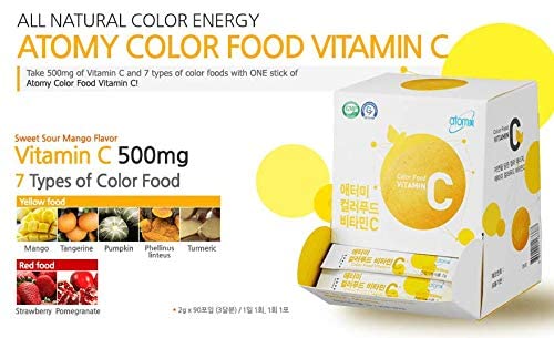 ATOMY Colorfood Vitamin C powder being poured into glass for easy beverage addition.