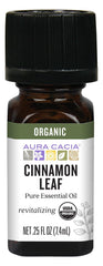 Aura Cacia Cinnamon Leaf Oil bottle pour, inviting aroma for diffusers and cozy spaces.