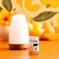 Aura Cacia Citrus Burst ingredients showcase natural color from botanicals and pure oils.