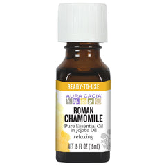 Aura Cacia Roman Chamomile in Jojoba Oil bottle pour for calming rituals.