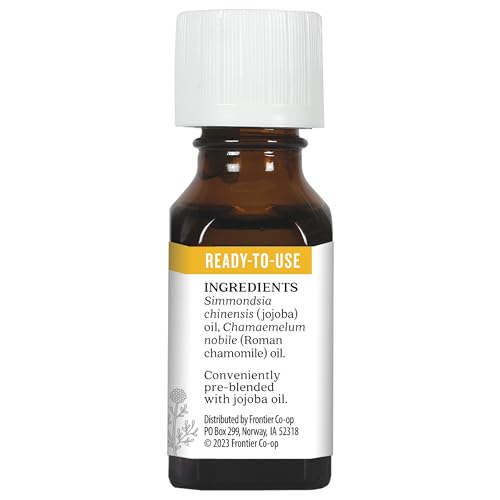 Aura Cacia Roman Chamomile in Jojoba Oil spa setup suggests relaxation and self-care.