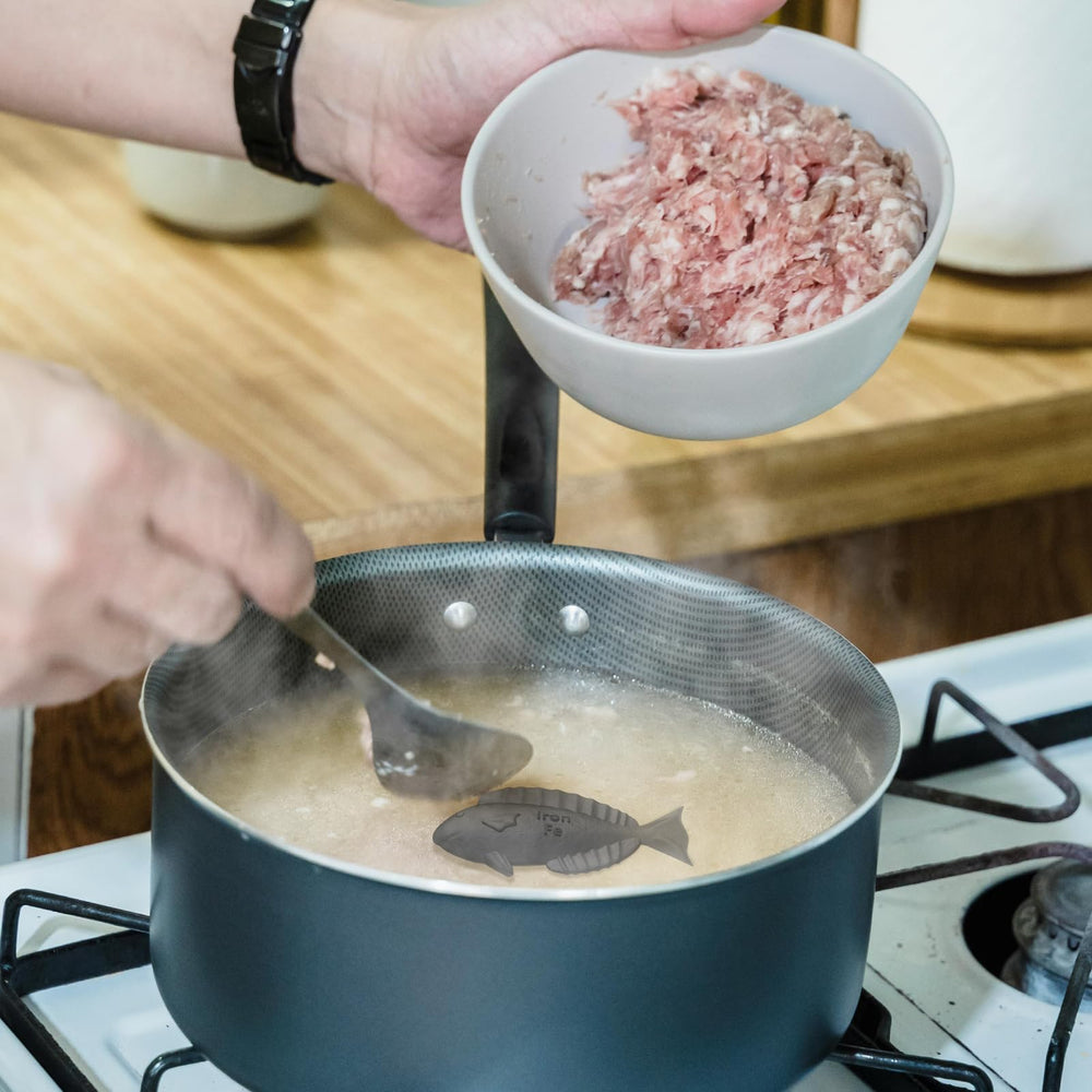 Aurionix Iron Fish with rice cooking shows convenient iron enrichment.