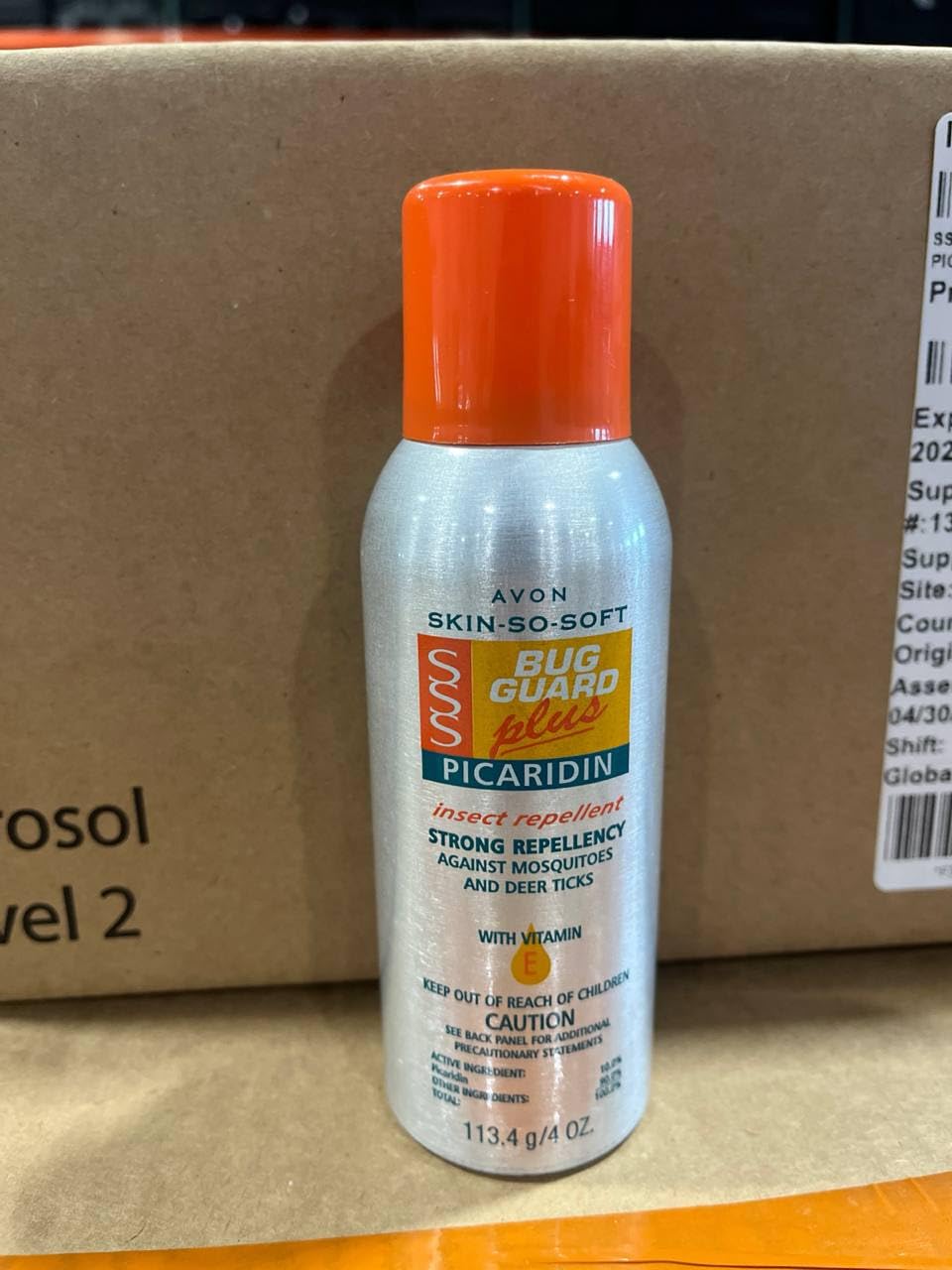 Family using Avon Skin So Soft Bug Guard outdoors.