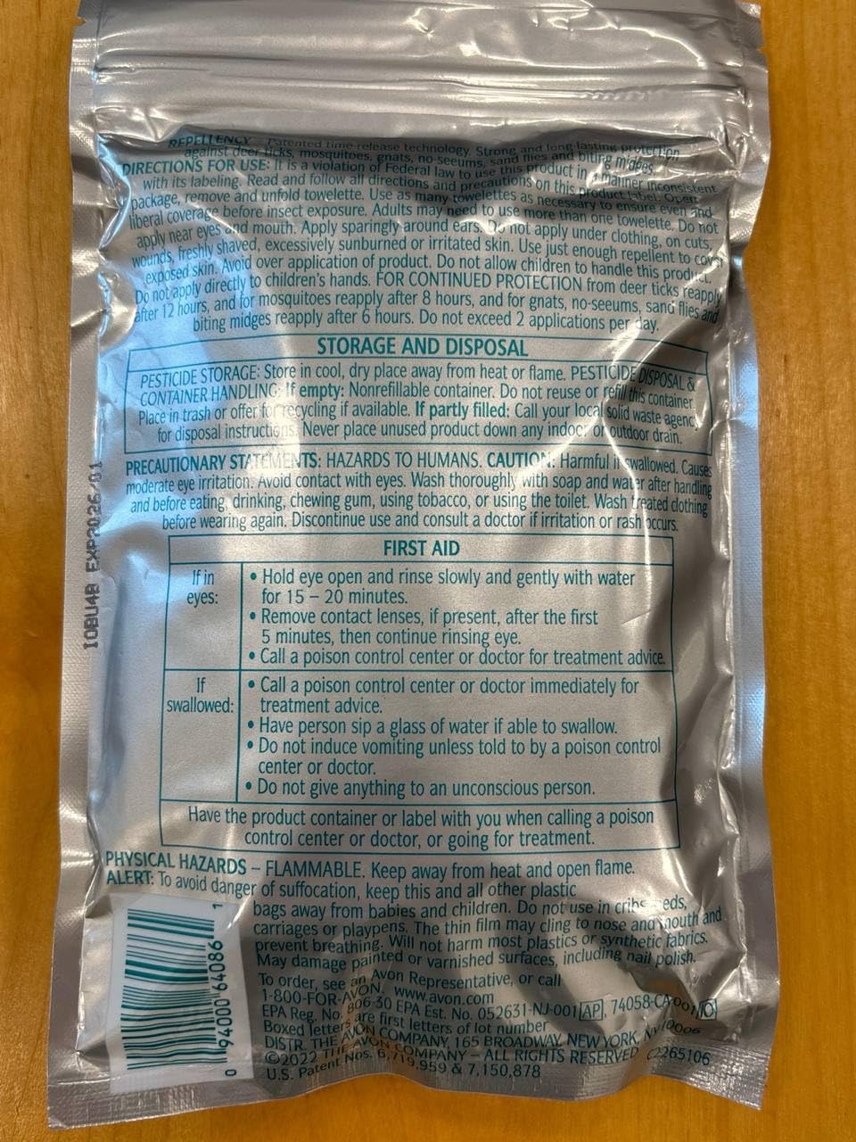 AVON Skin So Soft Bug Guard Towelettes travel-friendly packaging in pocket.