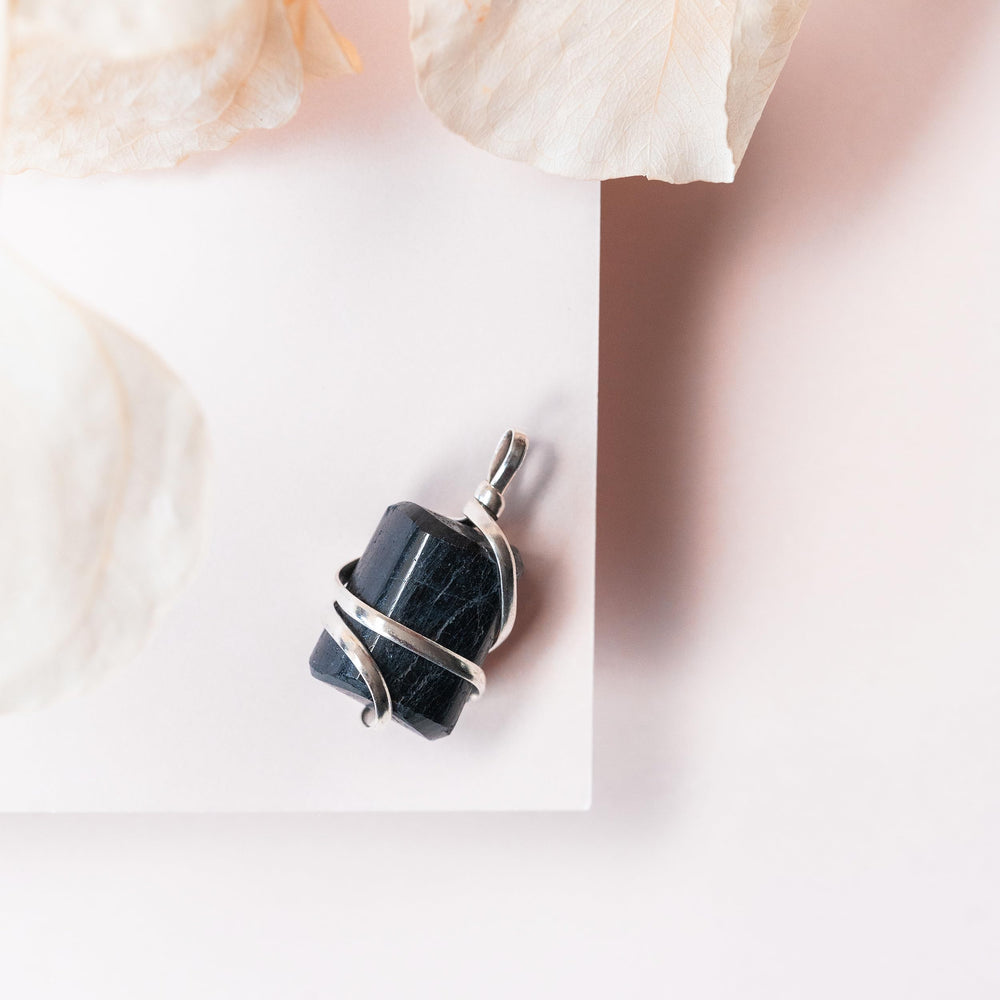 Ayana Wellness black tourmaline crystal closeup highlighting energy purification.