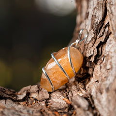 Ayana Wellness Citrine pendant worn on neck showcasing elegant style and positive energy.