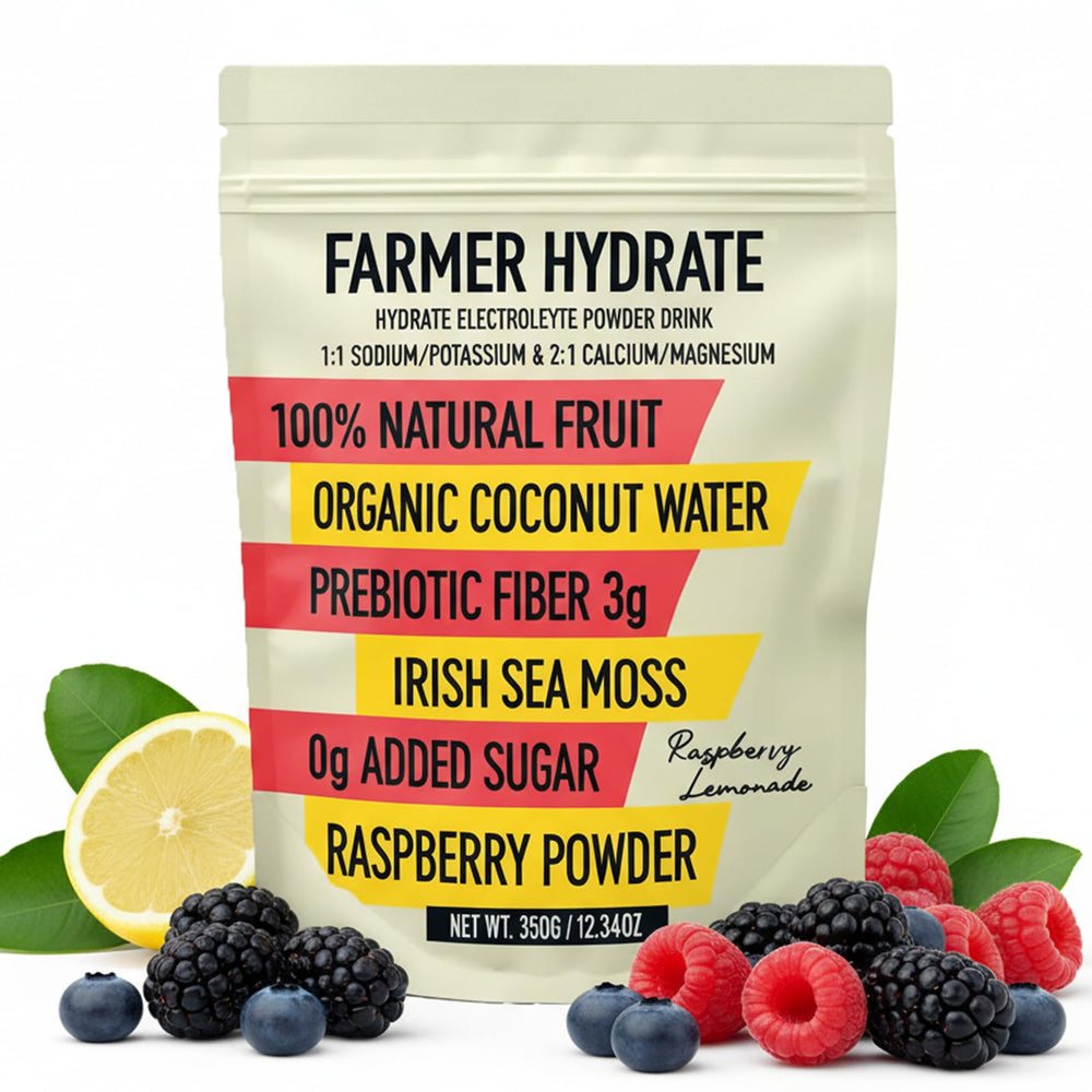 Ballerina Farm Hydrate powder beside a fruit juice glass for on-the-go hydration.