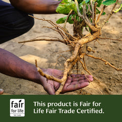 Banyan Botanicals Adrenal Nourish packaging on wood emphasizes sustainable sourcing.