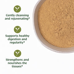 Banyan Botanicals Haritaki Powder scoop close-up, convenient measure for daily routines.