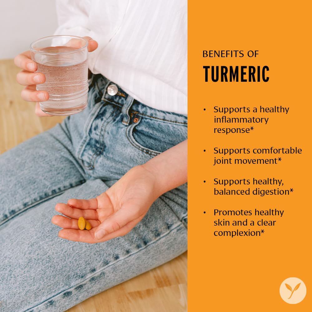 Banyan Botanicals turmeric tablets bottle pouring for easy daily dosing.