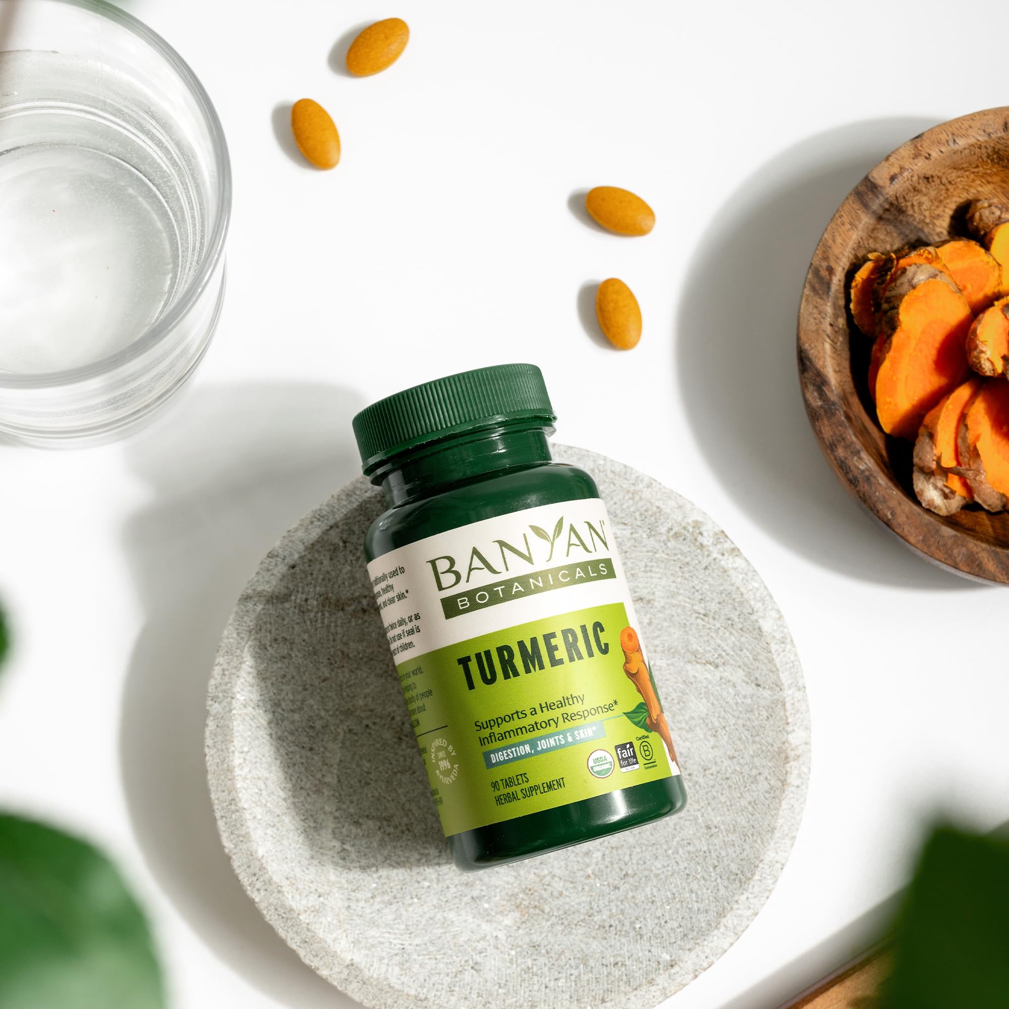 Banyan Botanicals turmeric tablets capsule close-up showing turmeric powder.