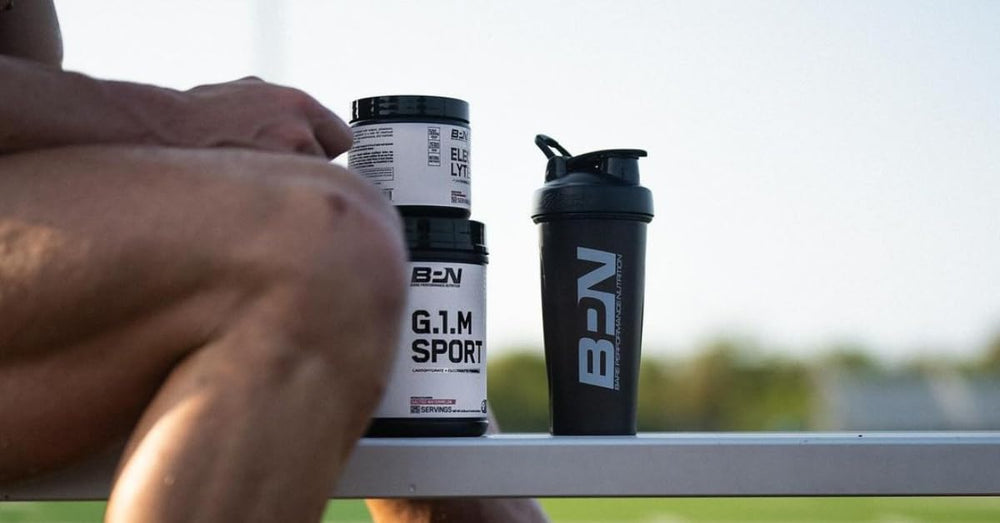 G1M being stirred in a glass to prepare a hydration drink during training