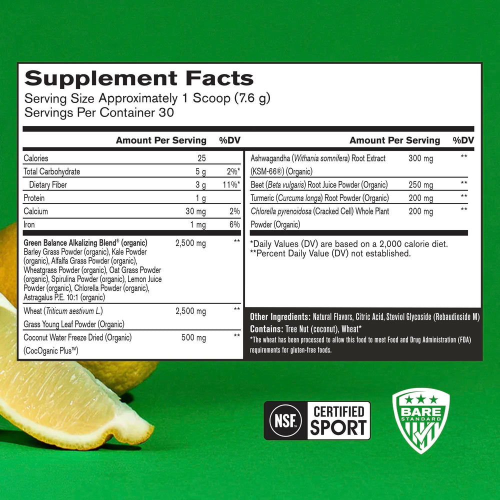 Scoop of Strong Greens beside a lemon for quick, tasty smoothies and focus.