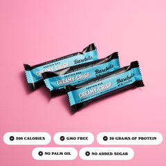 Cross-section view of Barebells Creamy Crisp reveals creamy center and chocolate coating.