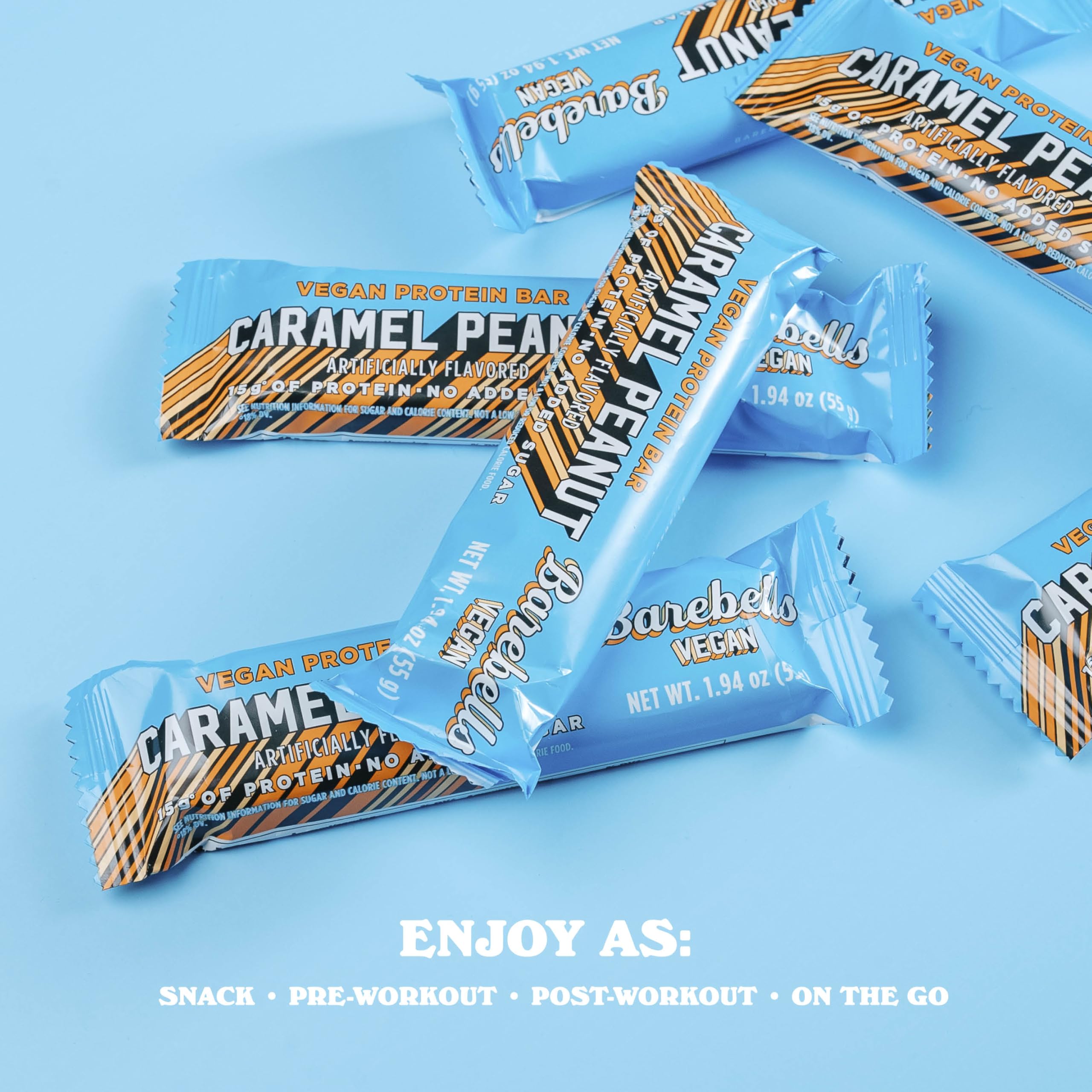 Person holding Barebells Plant Based Peanut Caramel bar for a quick snack.