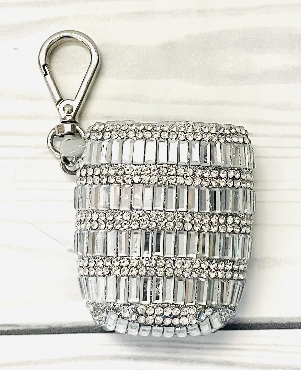 Close-up of baguette gemstones on the PocketBac holder detailing the design.