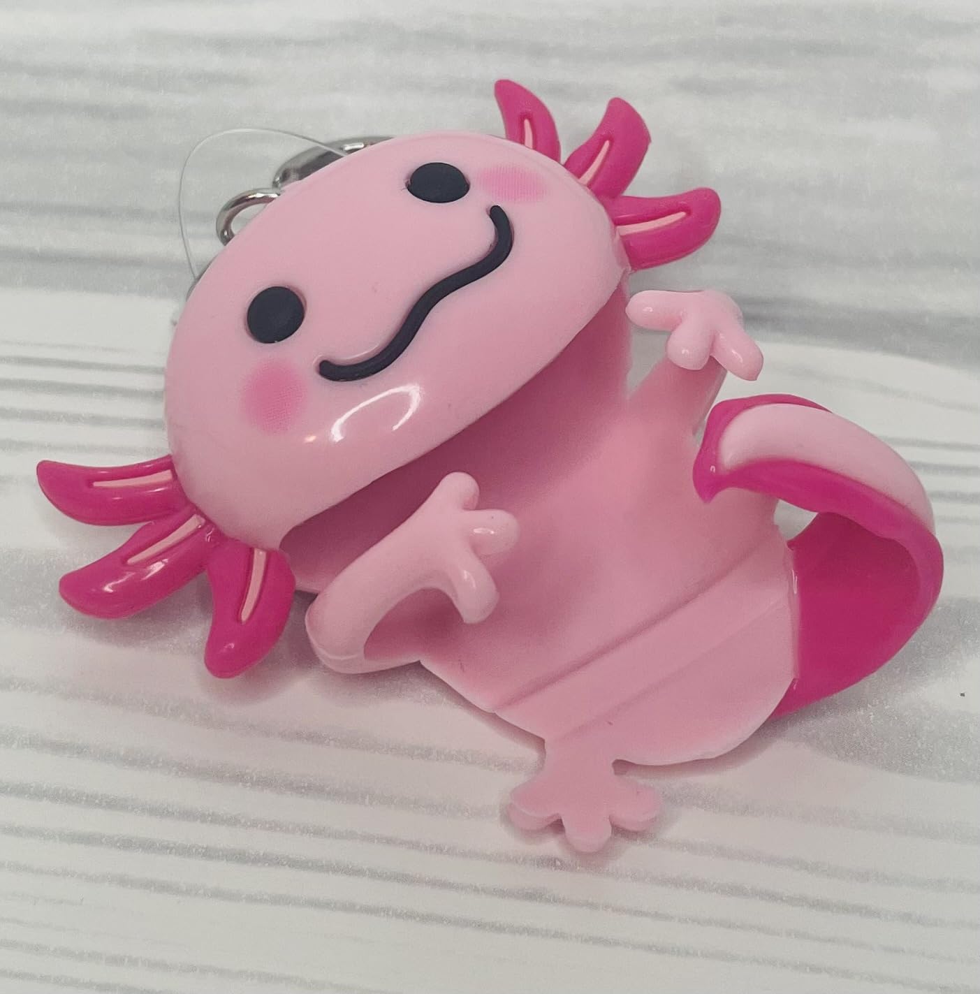 Bath & Body Works Pink Axolotl PocketBac Holder attached to backpack for on-the-go access