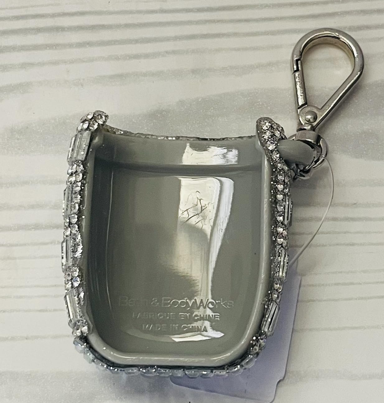 PocketBac holder attached to a bag for portable sanitizer access.