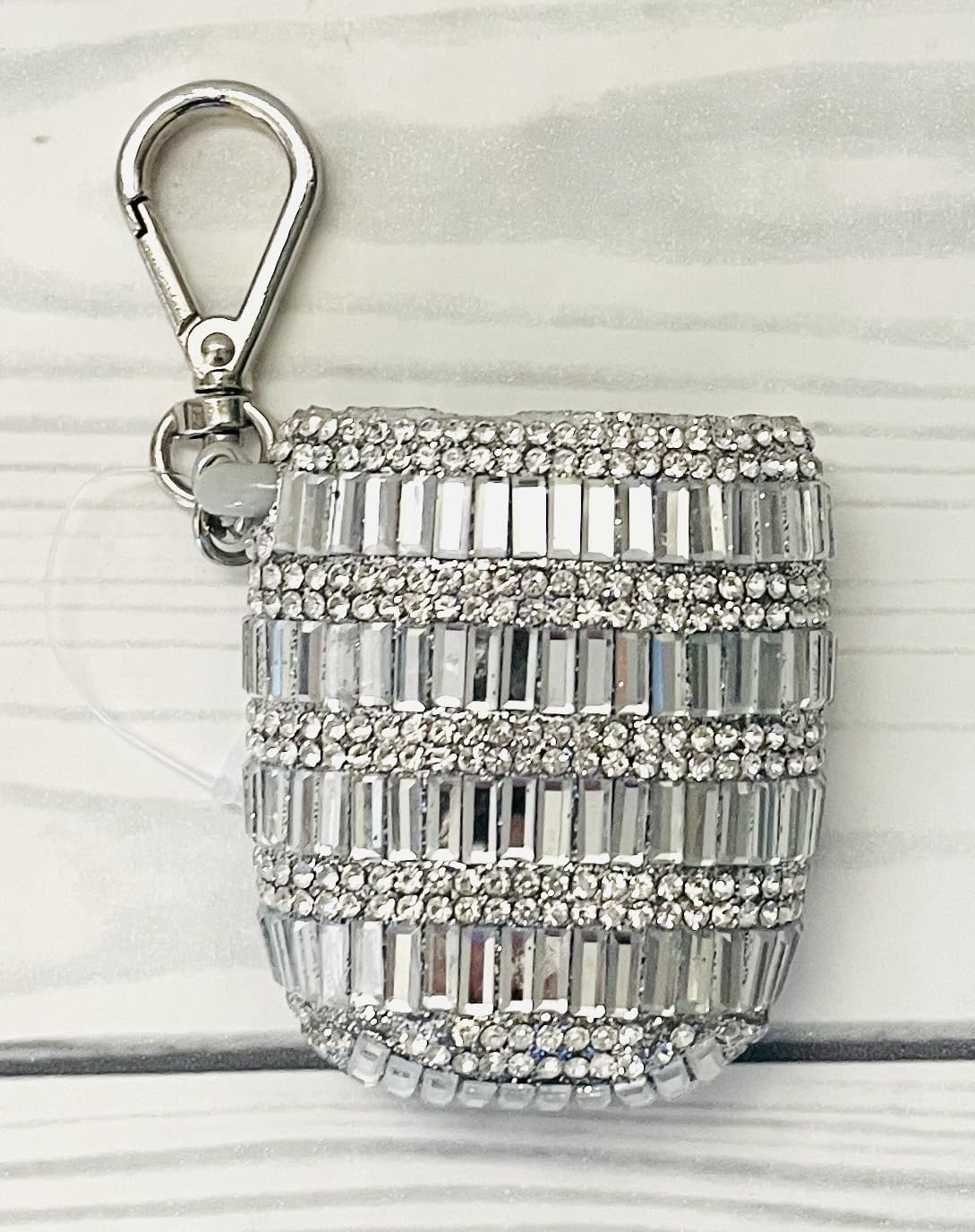 Silver-tone clip on the baguette gemstones PocketBac holder ready for travel.