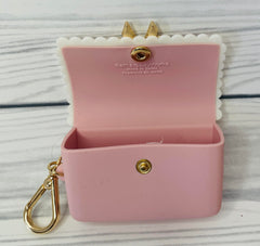 Bath and Body Works Sweetheart Song gold-accent clip secures the holder to bags for hands-free use.