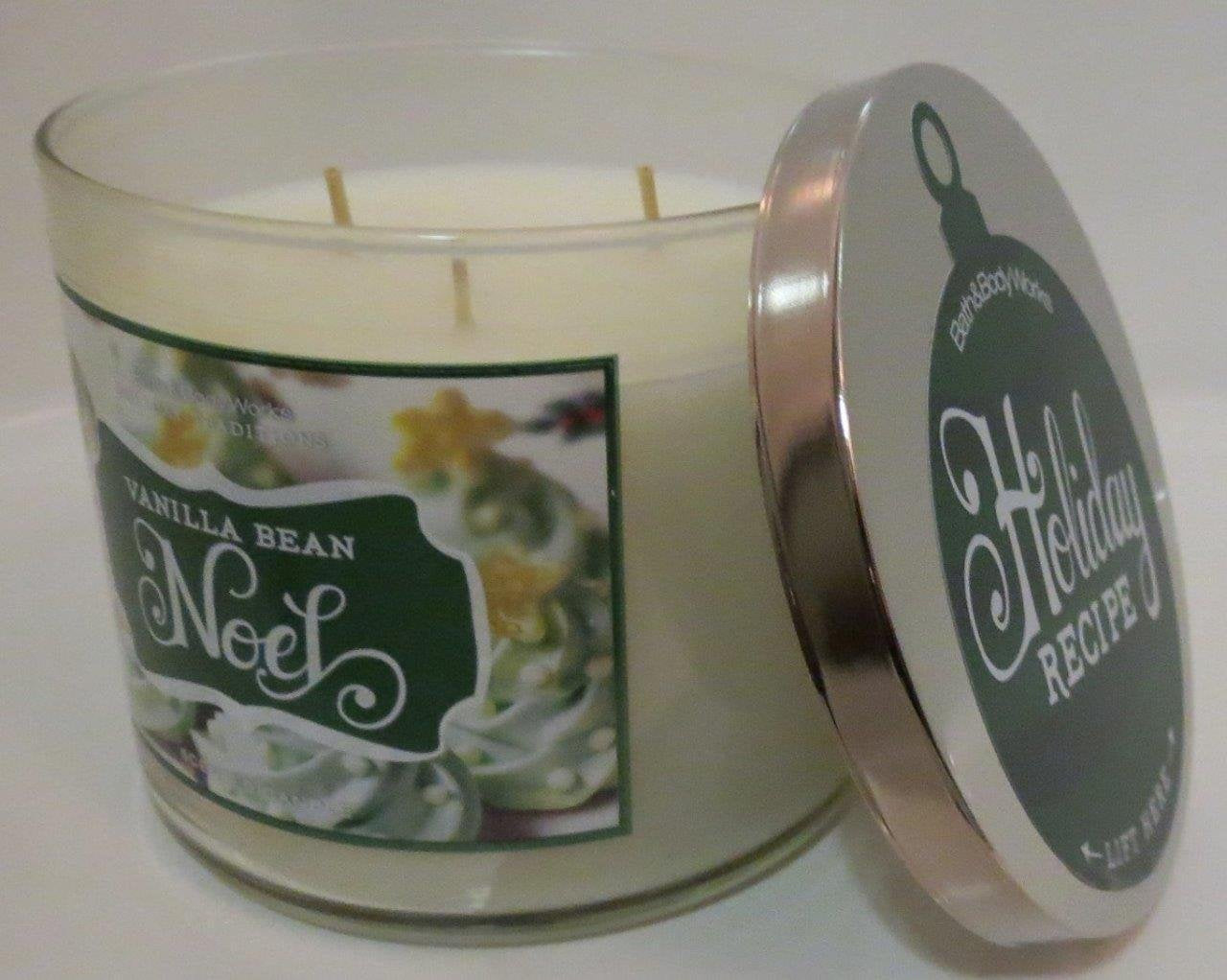Bath and Body Works Vanilla Bean Noel 3 Wick Candle with flame creates cozy holiday ambiance.