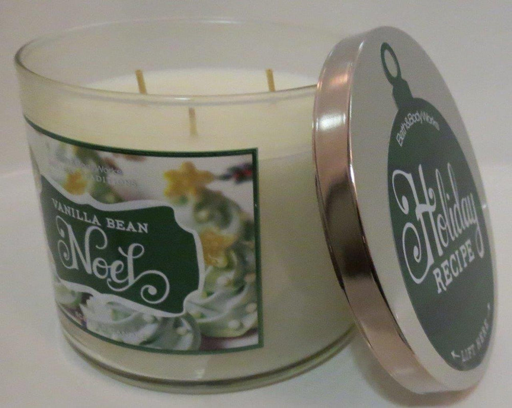 Bath and Body Works Vanilla Bean Noel 3 Wick Candle with flame creates cozy holiday ambiance.